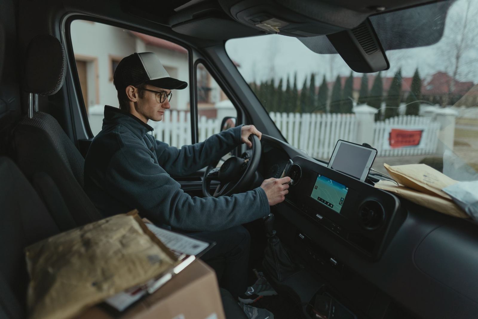 Courier driving a delivery van